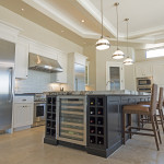 Phoenix Blackstone Custom Home Contemporary kitchen island with wine cooler and storage